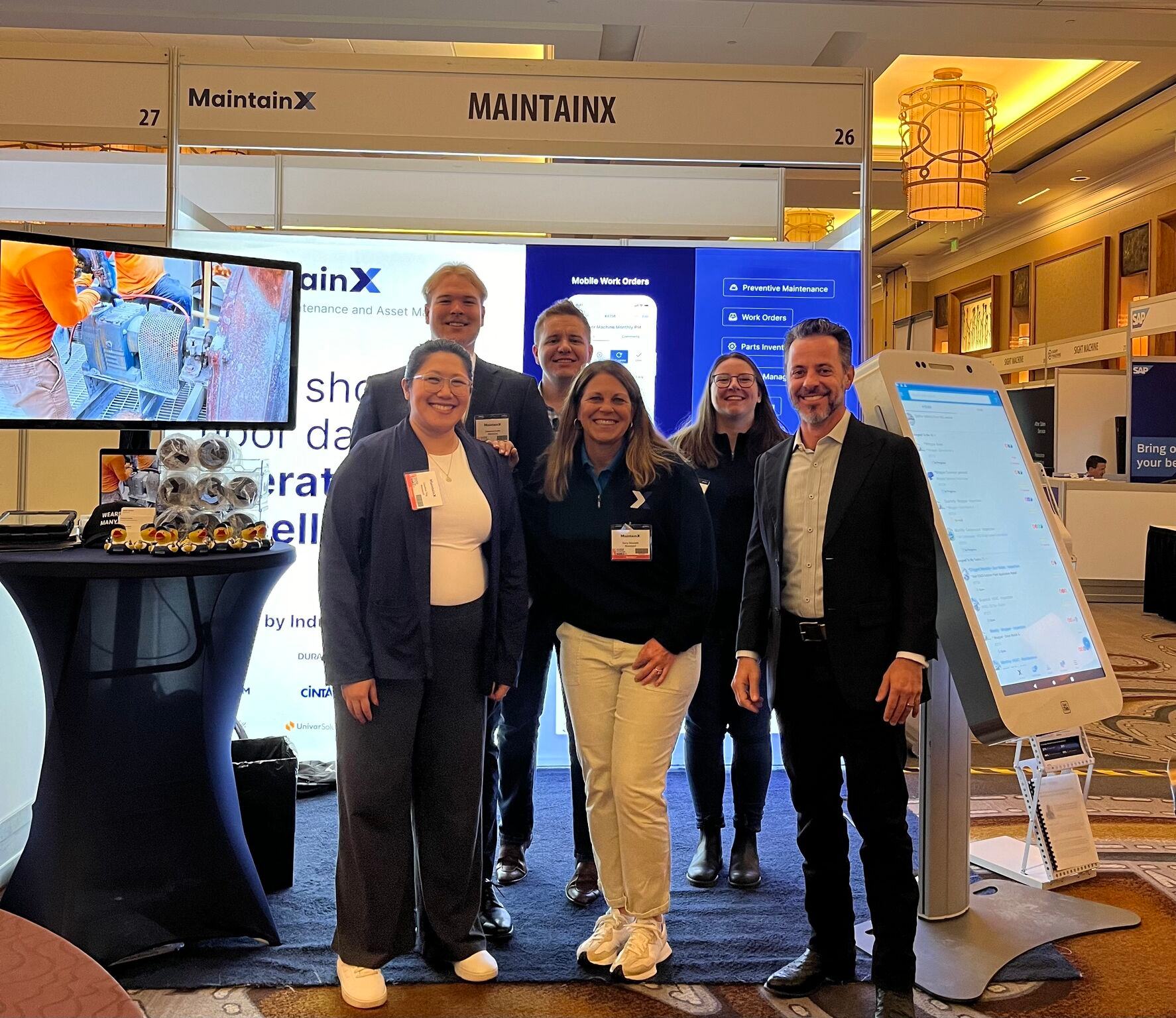 MaintainX team and branded booth at another event